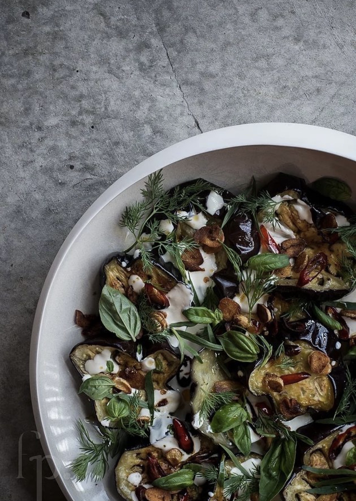 Roasted aubergine with basil, dill and pomegranate