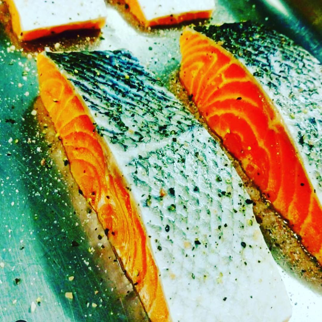 Fresh salmon fillets seasoned with pepper