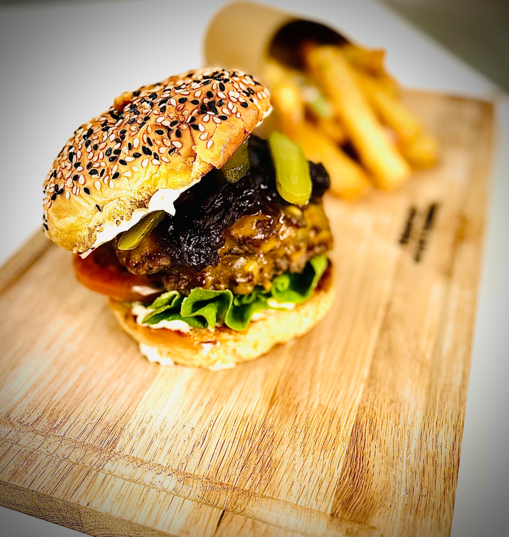 Gourmet beef burger with caramelised onion and fries