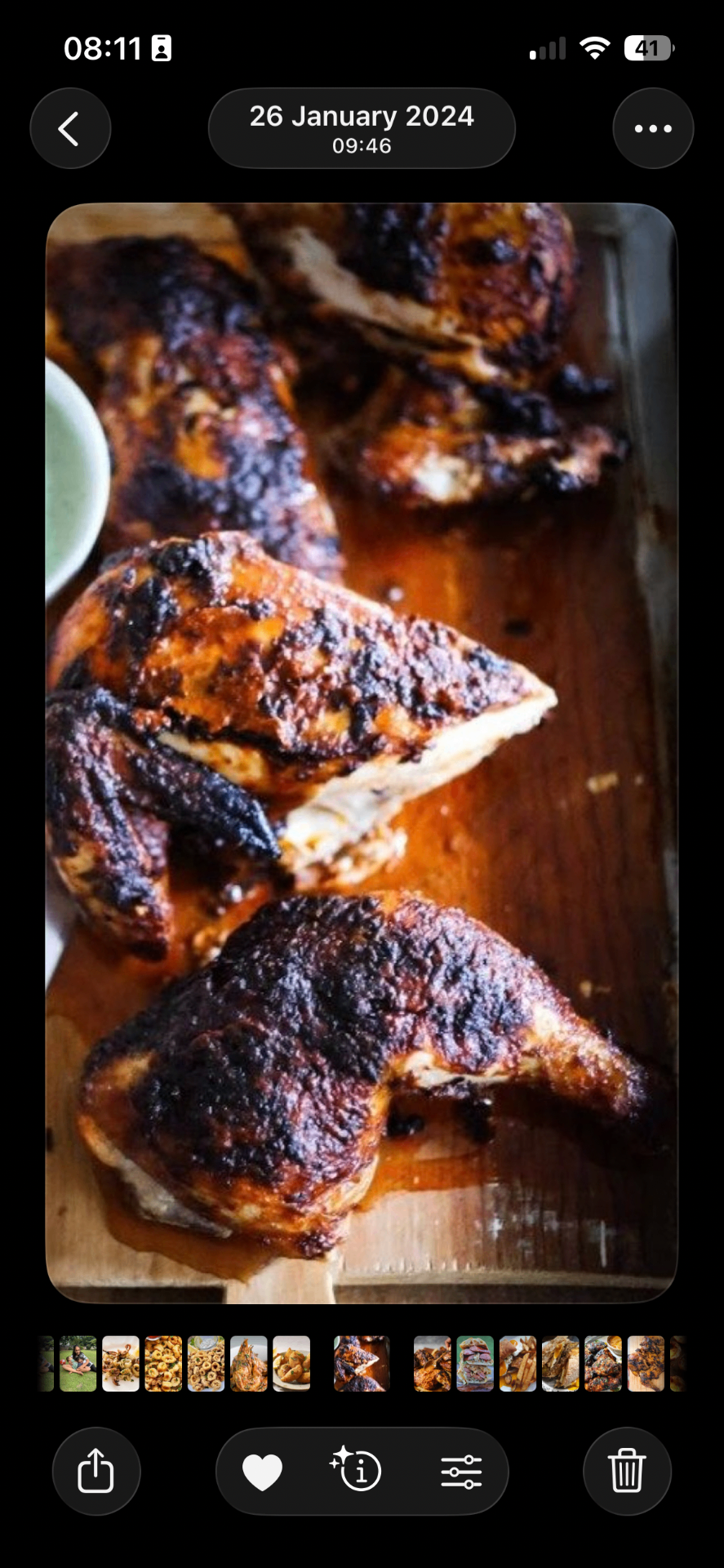Flame-grilled peri-peri chicken on a wooden board